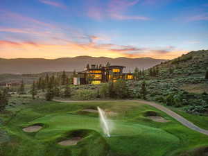 Surrounding community with a mountain view and golf course view