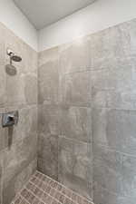 Bathroom featuring a tile shower