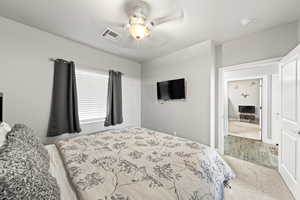 Bedroom featuring a ceiling fan and carpet flooring