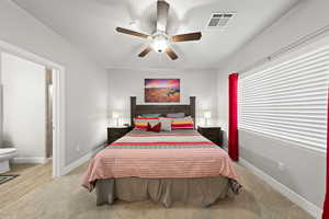 Bedroom with light carpet and ceiling fan