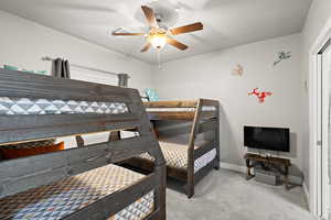 Bedroom with carpet floors and a ceiling fan