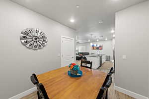 Dining space featuring light wood-style floors and recessed lighting