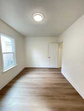 Spare room with light wood finished floors and baseboards