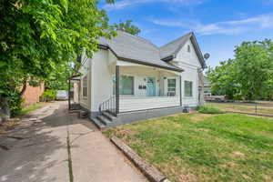 View of front of house with entry steps and roof with shingles