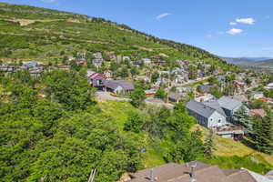 Aerial view of residential area featuring a mountain backdrop