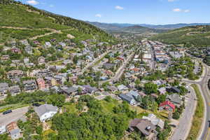 Aerial view of property's location with nearby suburban area