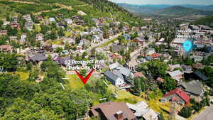 Aerial view of property's location featuring nearby suburban area