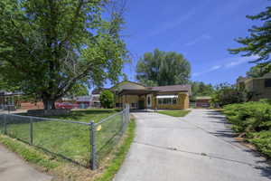 View of front of house featuring brick siding and concrete driveway