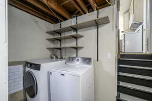Laundry room featuring independent washer and dryer