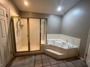 Bathroom featuring a whirlpool tub, a shower stall, tile patterned floors, and recessed lighting