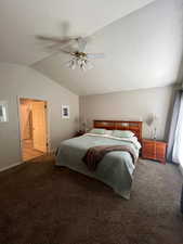 Bedroom with carpet, vaulted ceiling, and a ceiling fan