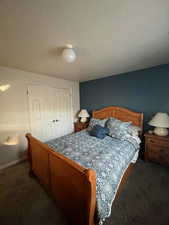 Bedroom with carpet flooring and a closet