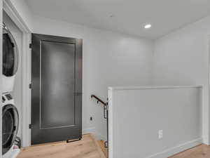 Washroom with stacked washing machine and dryer