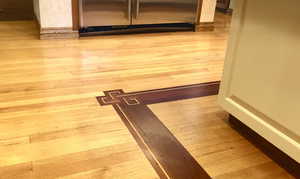 Detailed view of wood finished floors with inlay
