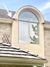 New flashing, gutter, stucco and window installed.