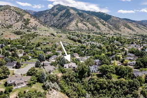 View of mountain backdrop featuring nearby suburban area