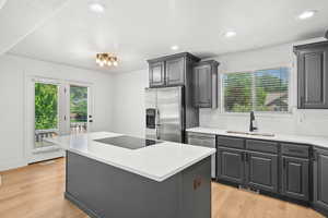 Kitchen featuring stainless steel appliances, healthy amount of natural light, decorative backsplash, and recessed lighting