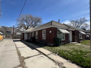View of side of property featuring cooling unit