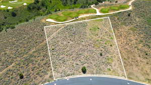 Aerial view of property's location featuring property boundaries highlighted and a local golf course