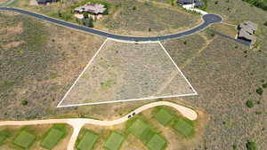 Aerial view of property and surrounding area with property parcel outlined