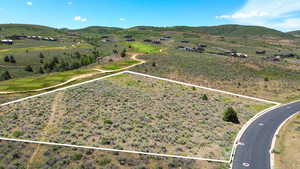 Aerial view of property's location with property parcel outlined and mountains