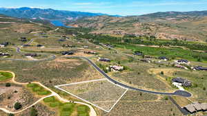 Aerial overview of property's location with property parcel outlined and mountains