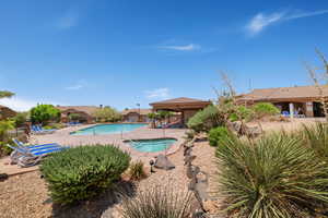 Community pool with a patio and a community hot tub