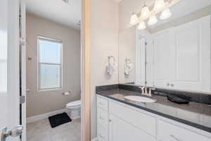 Bathroom with vanity and tile patterned floors
