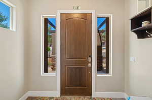 Foyer entrance featuring baseboards