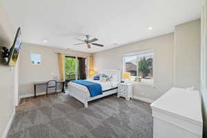 Bedroom featuring dark colored carpet, ceiling fan, and recessed lighting
