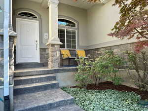Inviting entrance with a porch