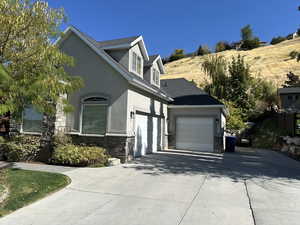 View of 2-car and 1-car garages