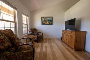 Living area featuring light wood finished floors and baseboards