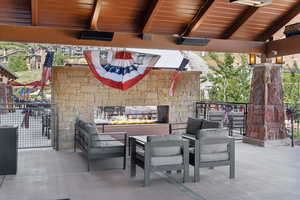 View of patio / terrace featuring an outdoor living space with a fireplace