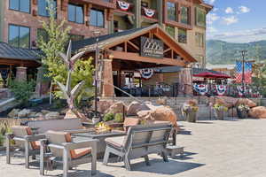 View of patio / terrace featuring a fire pit and a mountain view