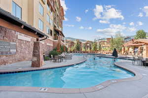 Community pool featuring a patio