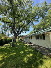Gorgeous, mature trees offer shade and privacy on this amazing corner lot