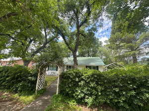 Lush, landscaped yard, mature trees, shade and privacy.