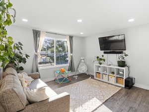 Living area with recessed lighting and wood finished floors