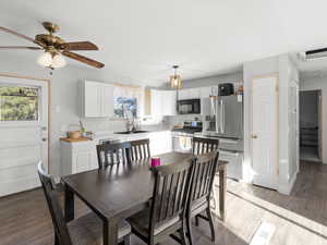 Dining area featuring light wood-style flooring and a ceiling fan