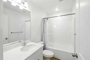 Full bathroom featuring vanity and shower / tub combo with curtain