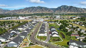 View of property location with mountains and nearby suburban area