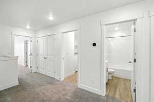 Hallway with carpet and recessed lighting