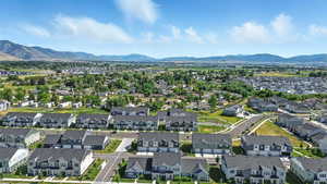 Aerial perspective of suburban area with a mountain backdrop