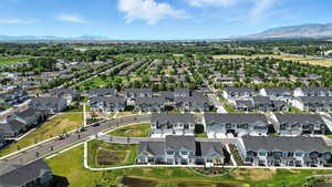 Aerial perspective of suburban area featuring a mountain backdrop