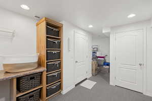Mudroom featuring carpet and recessed lighting
