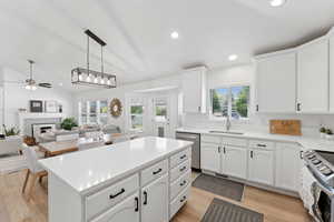 Kitchen with stainless steel appliances, plenty of natural light, a ceiling fan, light wood-type flooring, and recessed lighting