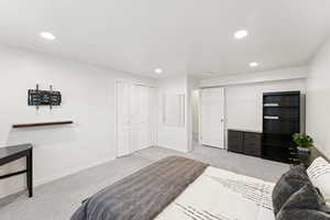 Carpeted bedroom featuring recessed lighting
