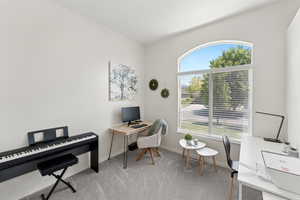 Carpeted home office with baseboards