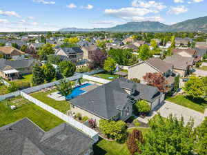 Aerial perspective of suburban area with a mountain backdrop